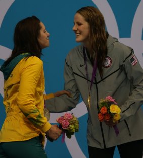 Different fates: Emily Seebohm and Missy Franklin share the dais.