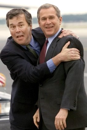 Then-Florida governor Jeb Bush, left, hugs his brother then-president George W. Bush upon his arrival in Orlando in 2001.