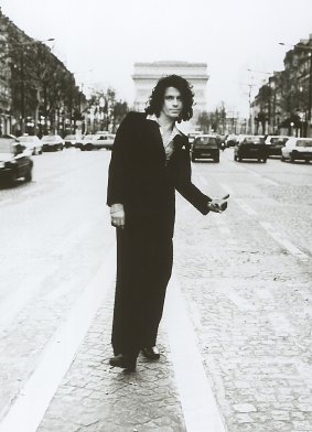 Rock singer Michael Hutchence from INXS hitch-hiking in Paris. 