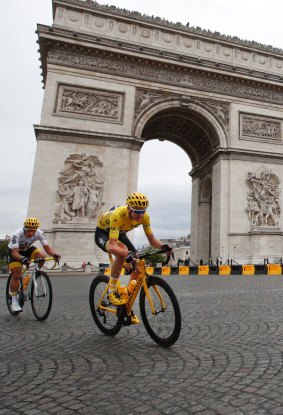 Chris Froome, wearing the overall leader's yellow jersey, is followed by teammate Colombia's Sergio Henao Montoya.