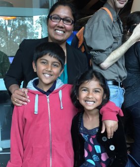 Abhishek, 8, and his sister Deepika, 6, with their mum at Robotronica. 