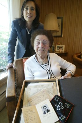 Sala Kirschner, with her daugher Ann, holds some of the letters and documents she saved from her time in concentration camps during World War II, at their home in Monsey, New York, 2005.