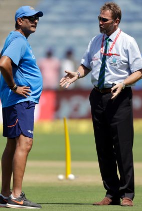 Match referee Chris Broad talks with Indian coach Ravi Shastri before the start of second one-day international.