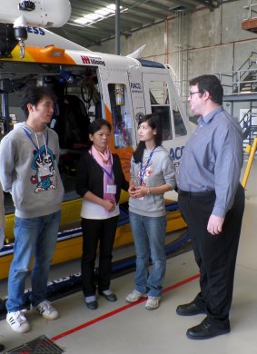 Che Yu, Linling's mother and Peng Linling visiting RACQ CQ Rescue, with federal MP George Chirstensen.