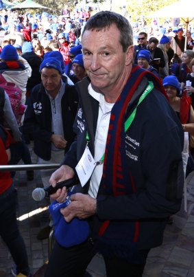 Fans gather at Federation Square for Neale Daniher's walk to the MCG.