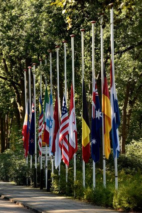 Flags from all the nations of the MH17 victims fly at half mast at the entrance to the military base in Hilversum.