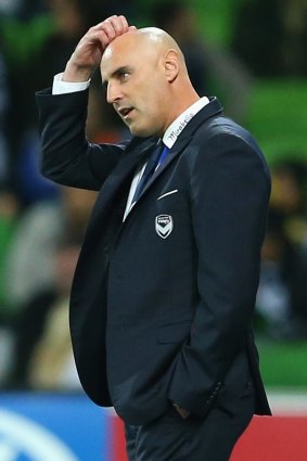 Victory coach Kevin Muscat appears puzzled as he watches the match in progress on Friday night.