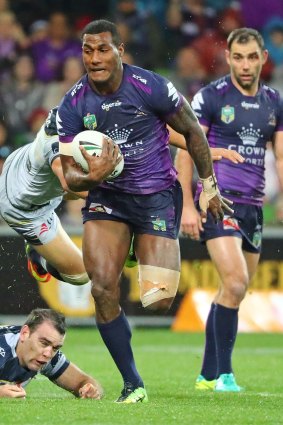 Storm's Suliasi Vunivalu runs away to score Melbourne's first try.