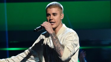 Taskforce Argos detectives have charged a 42-year-old man with more than 900 child sex offences after he allegedly posed as Justin Bieber to groom children.