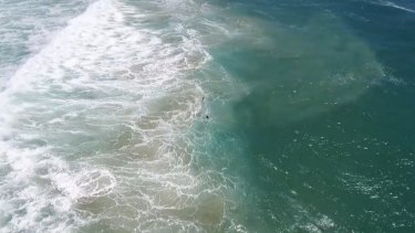 The two swimmers were seen struggling in heavy surf at Lennox Head. 