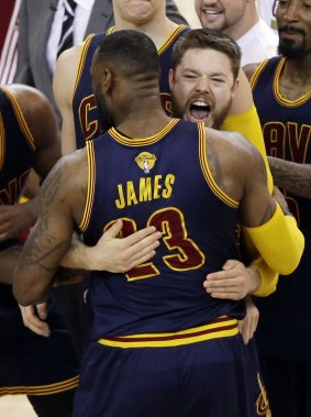 The King and I: Cleveland Cavaliers teammates Matthew Dellavedova and LeBron James embrace after the end of the overtime period.