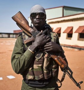 A South Sudanese government soldier in the town of Bentiu after it was recaptured from rebels in January this year.