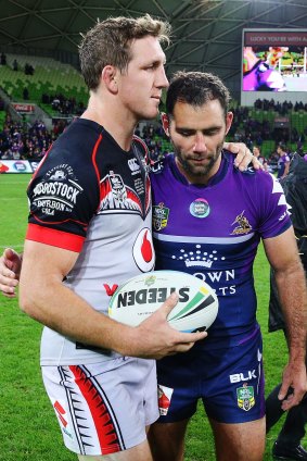 Ryan Hoffman of the Warriors and Cameron Smith of the Storm have a chat after the match on Monday.