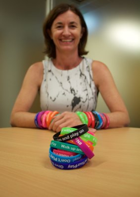 Griffith University Professor Sharyn Rundle-Thiele is handing out 19,000 wristbands to Schoolies in 2016 to test a selection of positive messages.