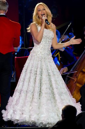 Here comes the bride? Kylie Minogue dons bridal-esque white gown to serenade Queen at 90th bash at Windsor Castle on Sunday night. 