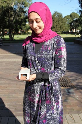 Sara Khalifa with the first gait-authentication prototype in hand. 
