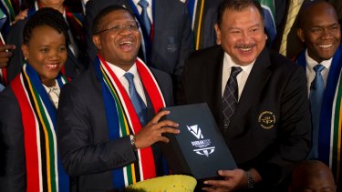 Happier times: South Africa's Minister of Sport and Recreation Fikile Mbalula (centre) holds Durban's 2022 Commonwealth Games bid book in 2015.