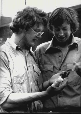 Tim Macartney Snape, 22 (right) who reached the summit of Mt. Dunagiri in the Himalayas looks at the frostbitten fingers of teammate Lincoln Hall. June 10, 1978.