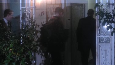 AFP agents raid a Labor staffer's house in Melbourne.