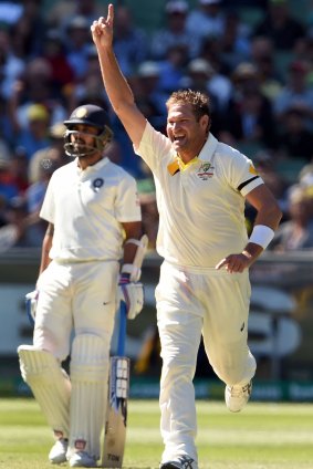 Breakthrough: Ryan Harris after snaring the wicket of Shikhar Dhawan.