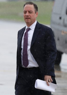 Fate sealed: White House Chief of Staff Reince Priebus walks to board Air Force One on Friday, hours before he was sacked.