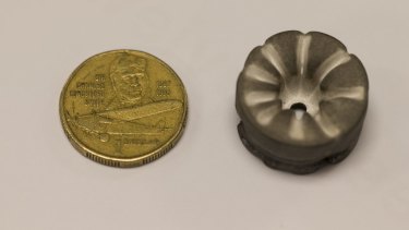 One of the 2.5 centimetre diameter magnesium cathodes (right) from Dr Neumann's ion drive after use.