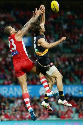 Alex Rance does battle with Lance Franklin of the Swans in the Tigers' final match for the year.