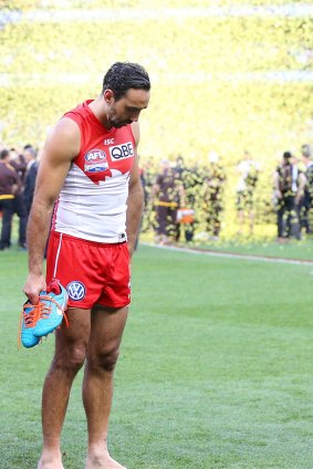 Down, but not out: Adam Goodes comes to terms with defeat in the grand final.