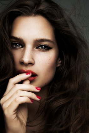 Warm skin tones try red polishes with a hint of gold shimmer.