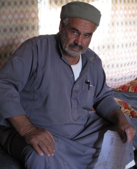 70-year-old Susiya resident Mohamed Nawaja holding what he says are the Ottoman-era title deeds to the family's land.