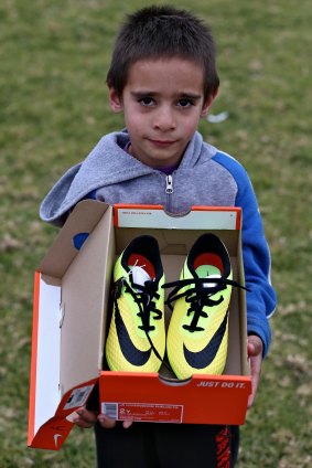 Sleeping in his boots: Nicko King was the first Wilcannia child to get new boots.