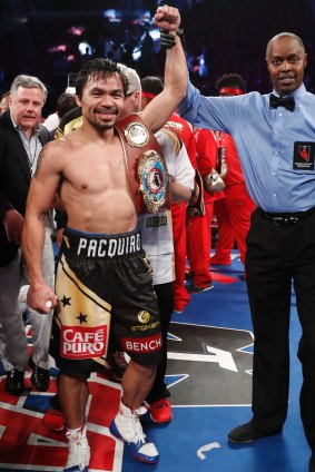 Champ: Manny Pacquiao celebrates his WBO welterweight title.