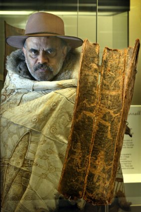 Gary Murray holding a famous and rare bark etching from Boort, Victoria.