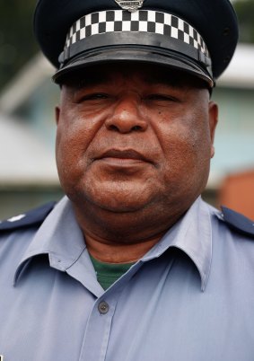 Manus Province police commander David Yapu, centre, said shots had been fired at the compound.