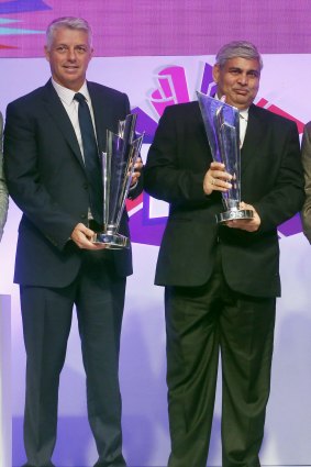 ICC chief executive David Richardson and ICC chairman Shashank Manohar pose with the ICC World Twenty20 trophies.