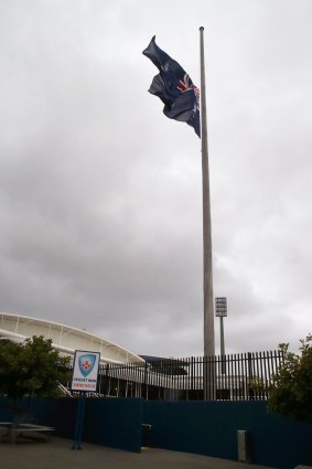 Mark of respect: The Australian flag is lowered to half mast at the Cricket NSW headquarters on Thursday afternoon.