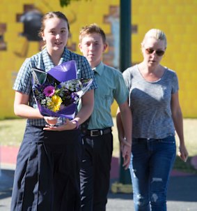 Locals left flowers at Dreamworld gates