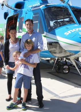Chris Kimball with his wife, Kerri, and children Violet and Noah with the Snowy Hydro Southcare helicopter.