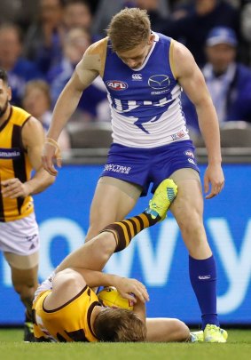 Jack Ziebell stands over Sam Mitchell.