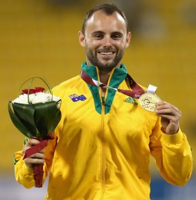 Reardon with his World Championships gold medal in Doha. 