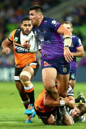 Out for the season: Melbourne Storm's Nelson Asofa-Solomona went off in the game against Wests Tigers on Sunday after tearing his posterior cruciate ligament.