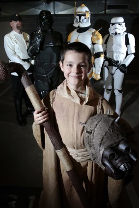 Unmasked:  Star Wars fans,  Zachary Kirk 9, of Tuggeranong, front with, rear from left, Drew Ridley of Macgregor, Toby Shorter of Woden, Travis Kirk of Tuggeranong and Karl Tyler of Bonner.