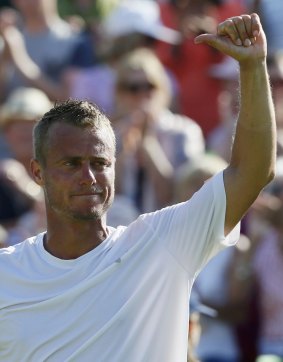 Bowing out ... Lleyton Hewitt of Australia gestures to the crowd after losing his match against Jarkko Nieminen of Finland at Wimbledon.