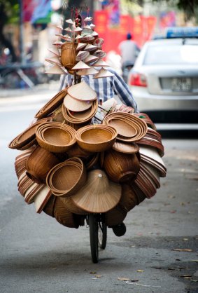 A hat vendor in Hanoi, Vietnam.