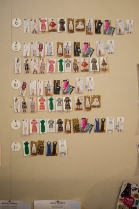 A wall at Her Wardrobe's Melbourne head office shows the dresses that are on order.