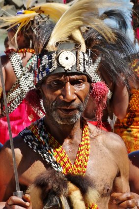 Royal welcome: A welcome dance on the beach at the village of Pasir Putih, West Papua.