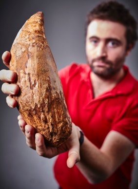 Dr Erich Fitzgerald with the sperm whale tooth. 