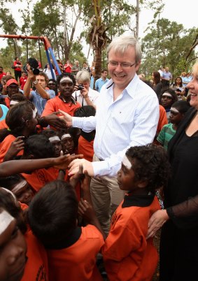 Kevin Rudd, pictured at a school in the East Arnhem Land community of Yirrkala in 2008, has warned of new "stolen generation".