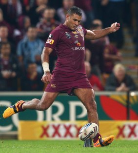 Maroons veteran Justin Hodges takes a kick that could have landed teammate Johnathan Thurston an Origin record.