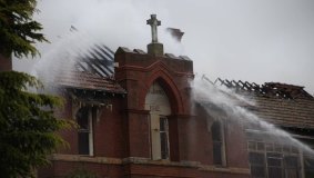 Firefighters at work extinguishing the blaze.